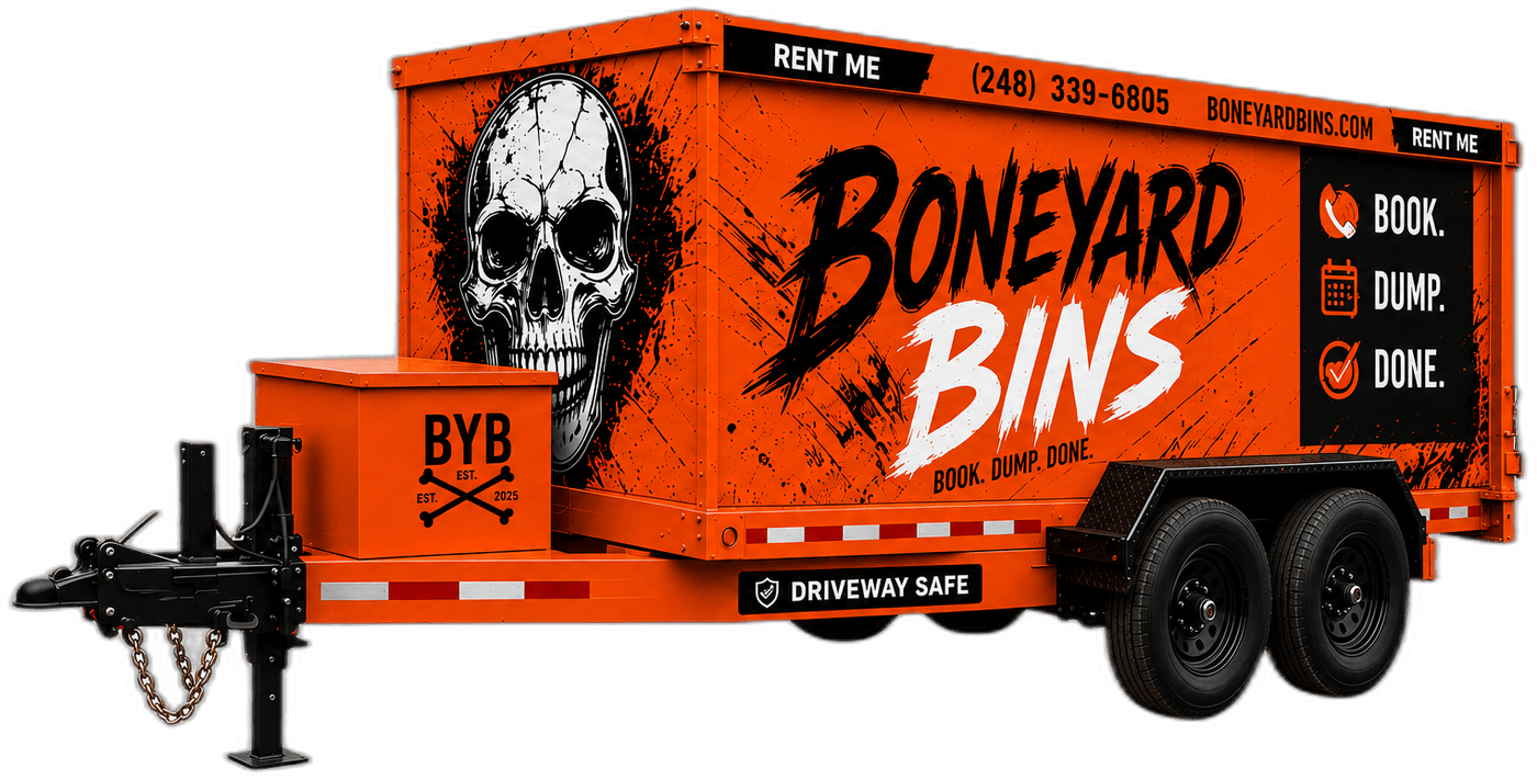 Boneyard Bins orange dumpster trailer with skull graphic, driveway safe